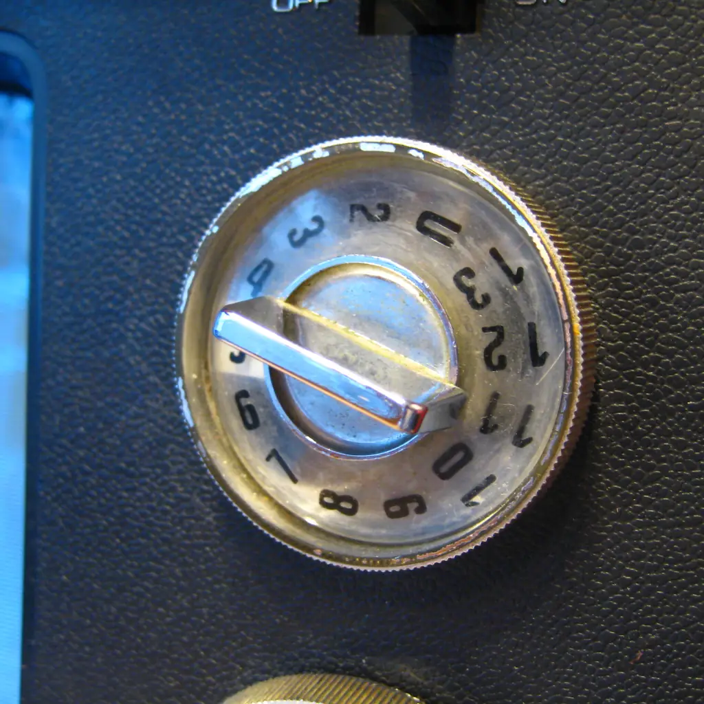 The channel selector on a 1970s Philco-Ford orange portable television.