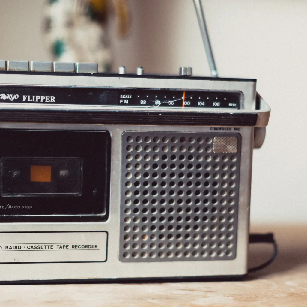 A Tokyo Flipper three-band radio cassette recorder on a shelf.